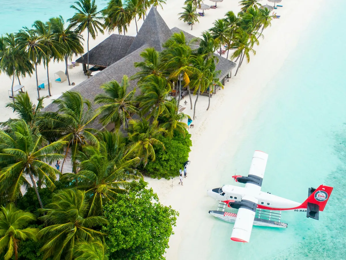 Seaplane on a turquoise tropical beach